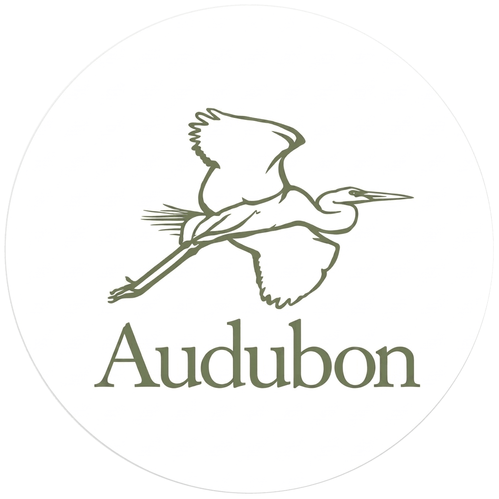 Audubon logo featuring an illustration of a bird in flight above the text “Audubon”. - Salon Aria + Spa in Davenport, IA